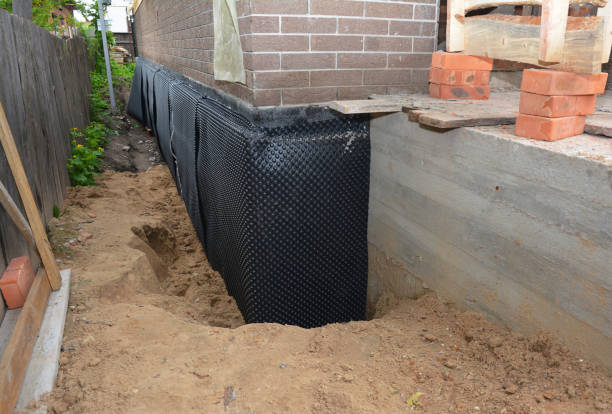 Happy homeowners after waterproofing job in Sharon Hill
